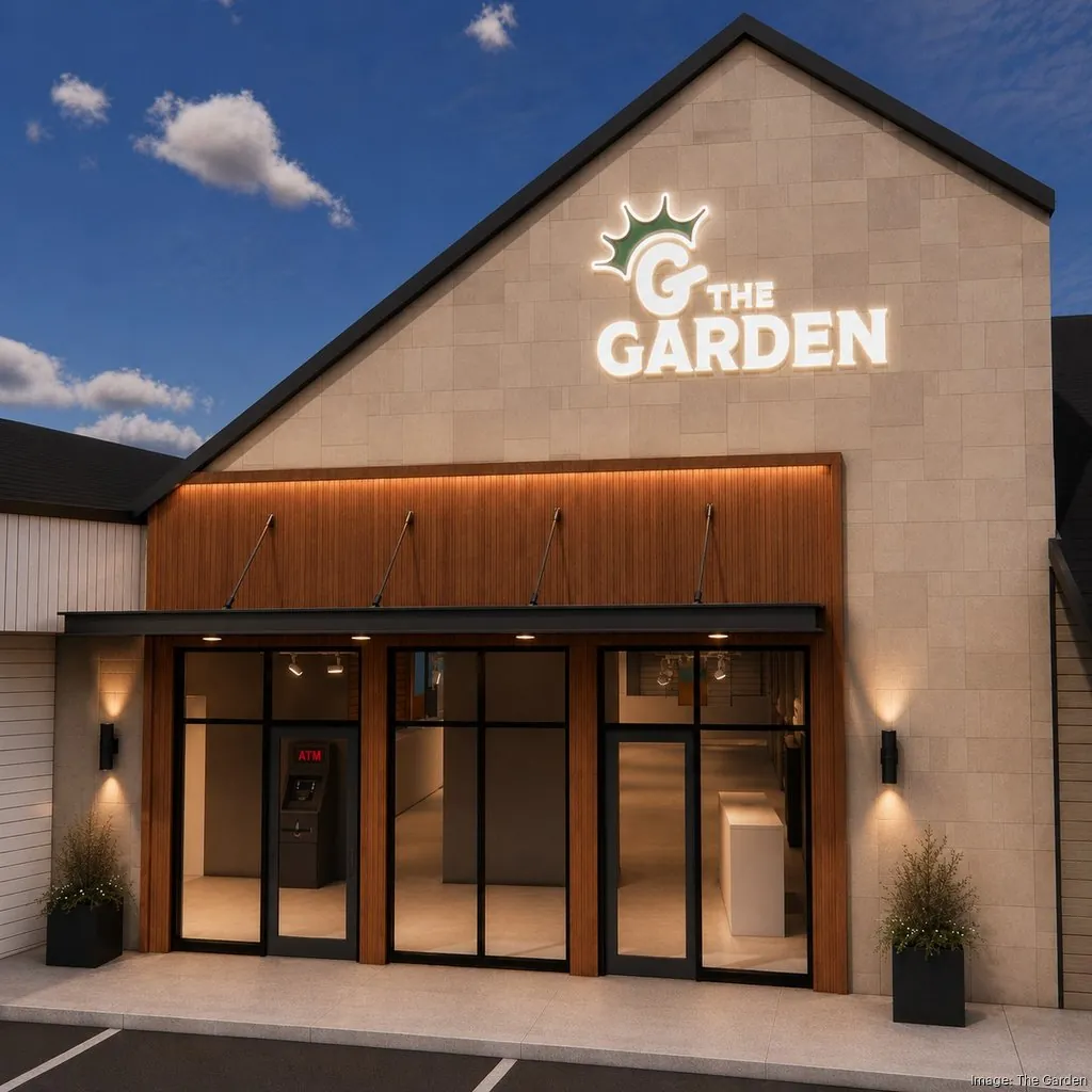Night rendering of The Garden in Colerain Township, the crowned G sign glowing on the stone gable above the entrance